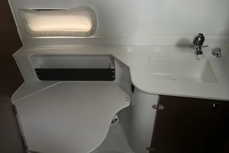 Slide: The Image of 2023 Beneteau Antares 9 bathroom interior with sink and storage. - 27