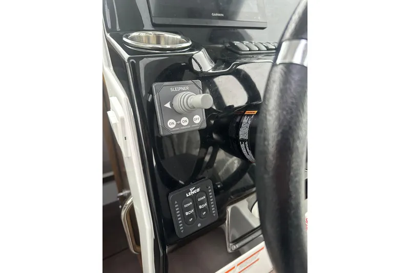 Slide: The Image of Control panel of 2023 Beneteau Antares 9 boat with steering wheel and switches. - 8