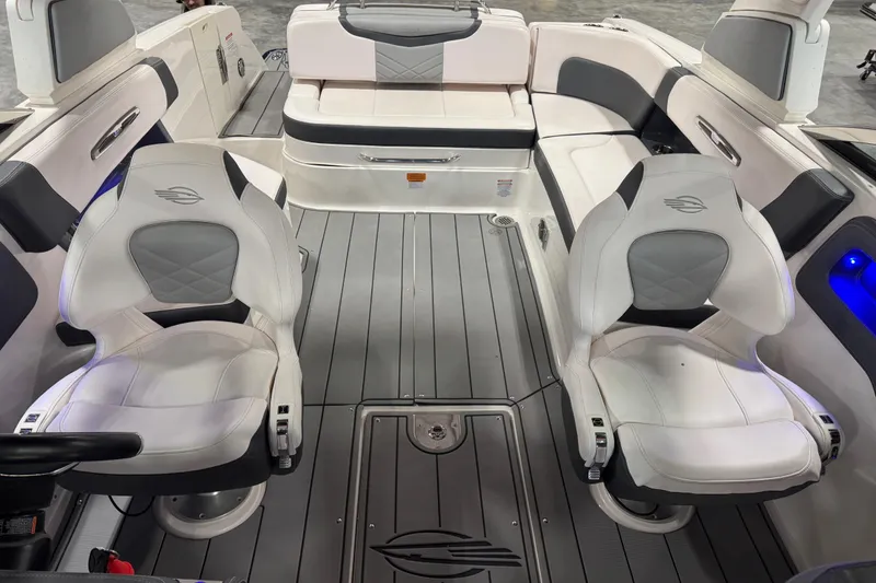 Slide: The Image of 2020 Chaparral 287 SSX boat interior with white seating and modern design. - 10