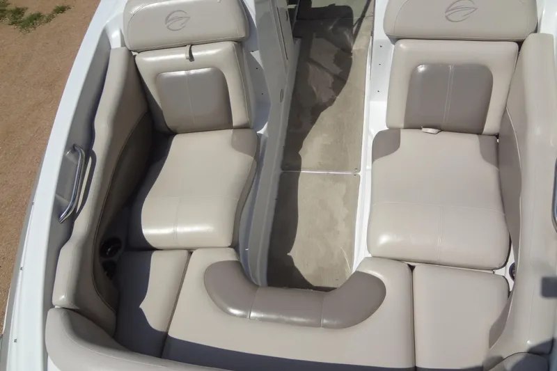 Slide: The Image of 2013 Crownline Eclipse E4 boat interior with beige seating and sleek design. - 10