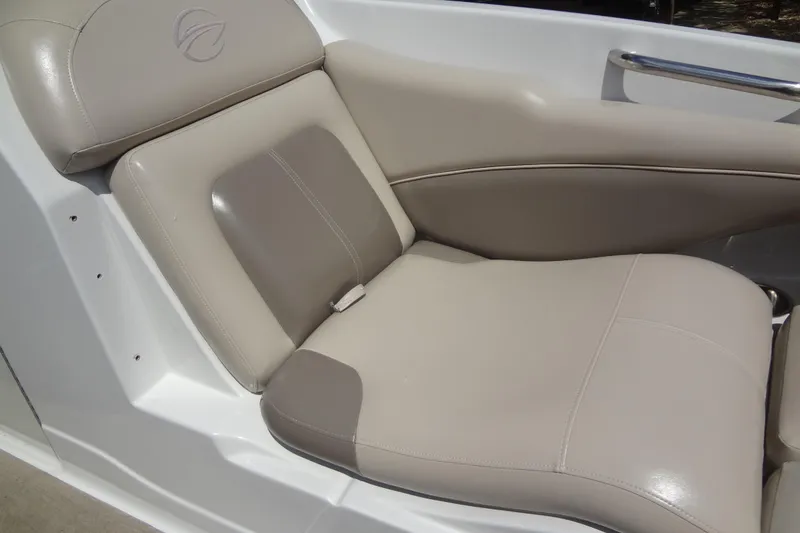 Slide: The Image of 2013 Crownline Eclipse E4 boat seat with beige upholstery and sleek design. - 13