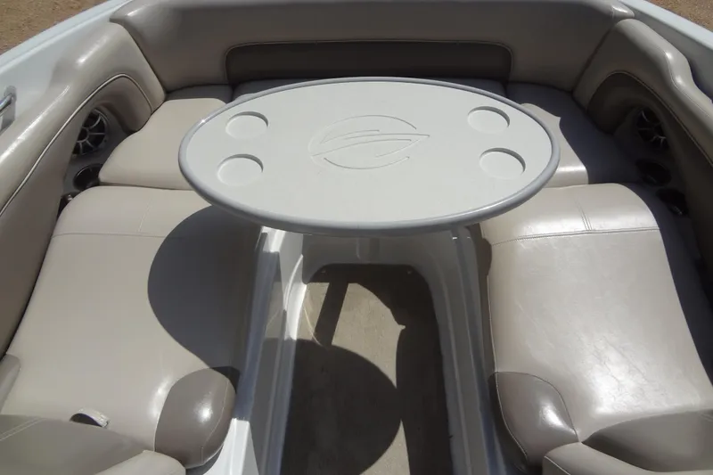 Slide: The Image of 2013 Crownline Eclipse E4 boat interior with seating and table. - 16