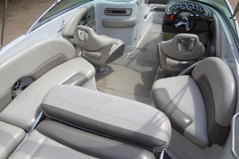 Slide: The Image of 2013 Crownline Eclipse E4 boat interior with plush seating and modern dashboard. - 22