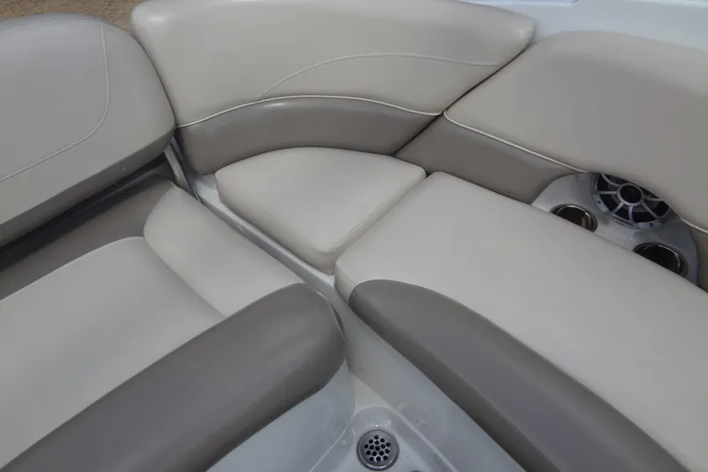Slide: The Image of 2013 Crownline Eclipse E4 boat interior seating with cup holders and speaker. - 24