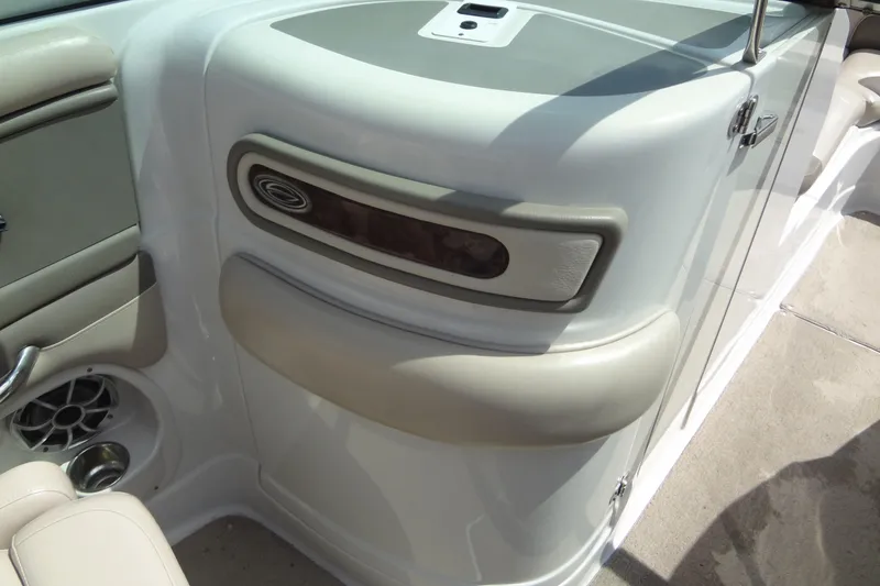 Slide: The Image of Interior view of a 2013 Crownline Eclipse E4 boat, featuring sleek design and speaker detail. - 29