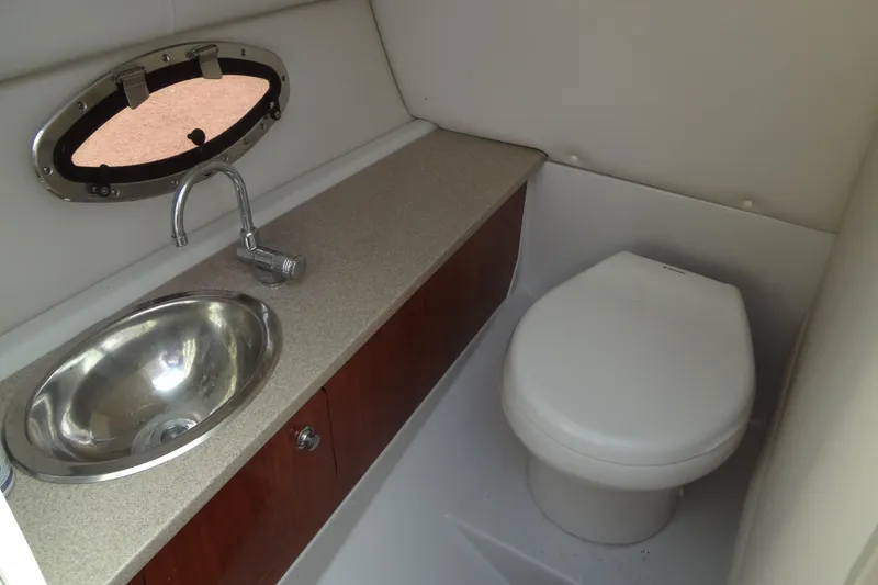 Slide: The Image of 2013 Crownline Eclipse E4 boat bathroom with sink and toilet. - 30