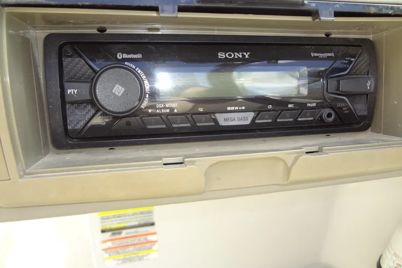 Slide: The Image of Sony stereo system in a 2013 Crownline Eclipse E4 boat dashboard. - 35