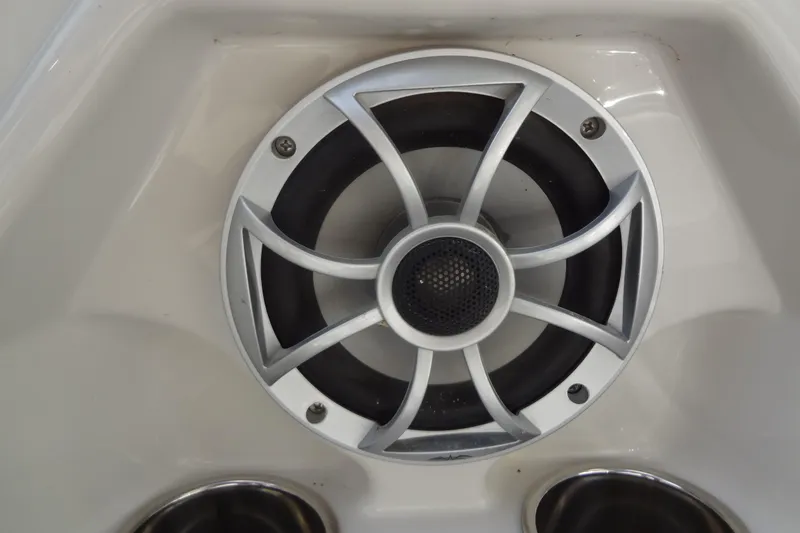 Slide: The Image of Speaker on 2013 Crownline Eclipse E4 boat, featuring sleek silver grille design. - 36
