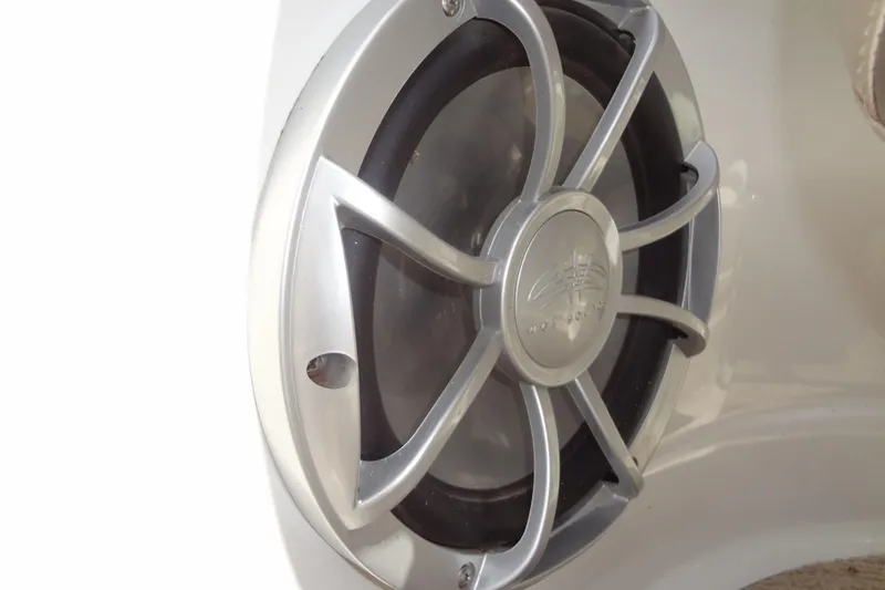 Slide: The Image of Close-up of a 2013 Crownline Eclipse E4 boat speaker with a silver grille. - 37