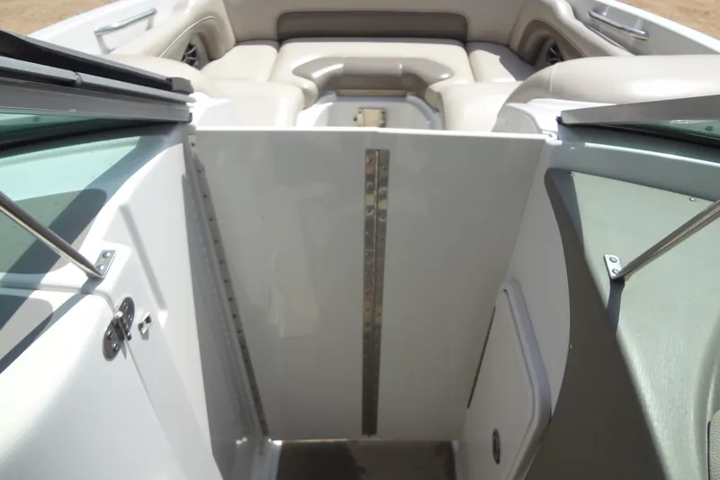 Slide: The Image of 2013 Crownline Eclipse E4 boat interior with seating and open door. - 38