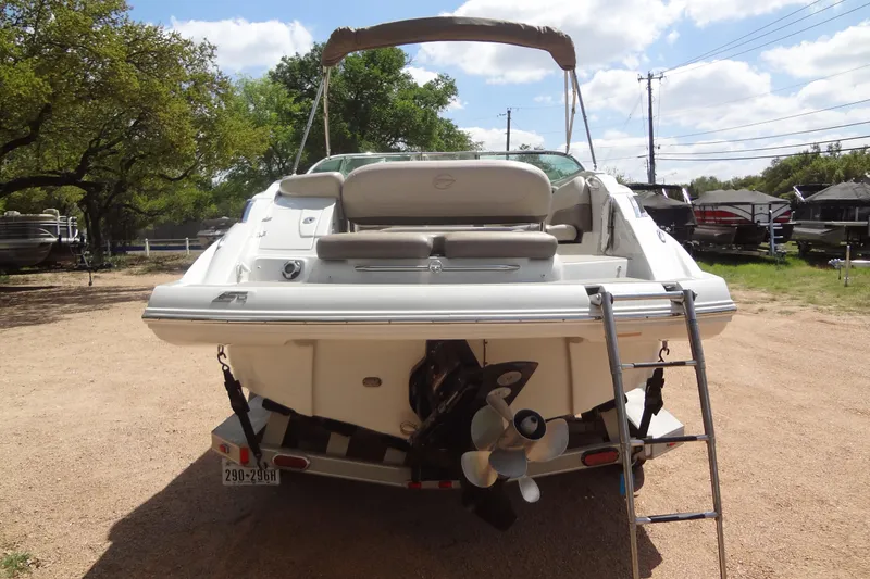 Slide: The Image of 2013 Crownline Eclipse E4 boat rear view with ladder and propeller. - 4