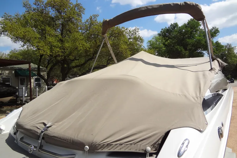 Slide: The Image of Trailer wheels for 2013 Crownline Eclipse E4 boat on gravel surface. - 47