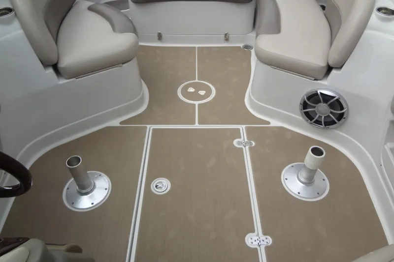 Slide: The Image of 2013 Crownline Eclipse E4 boat interior with beige seating and speaker system. - 49