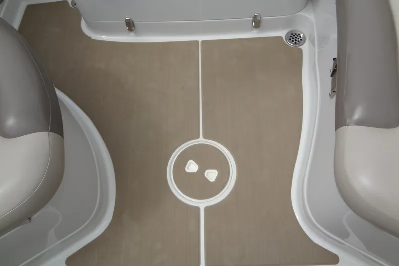 Slide: The Image of 2013 Crownline Eclipse E4 boat interior with beige flooring and gray seating. - 54