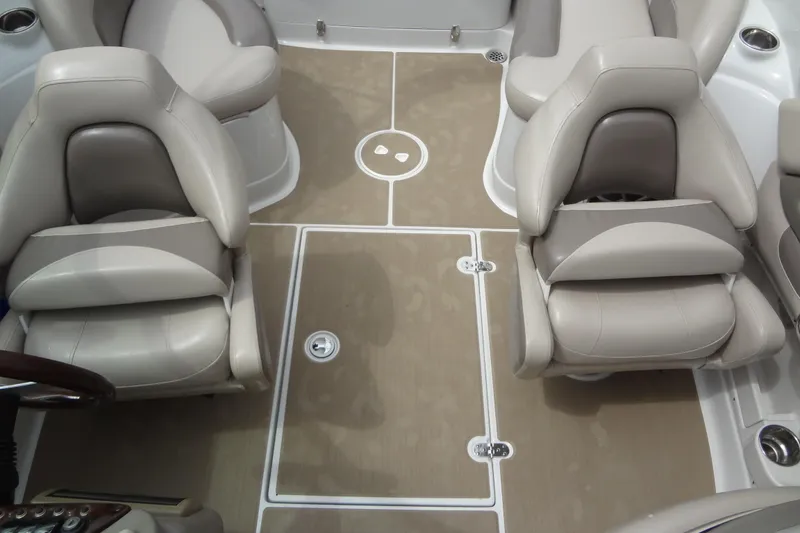 Slide: The Image of 2013 Crownline Eclipse E4 boat interior with beige seating and flooring. - 55