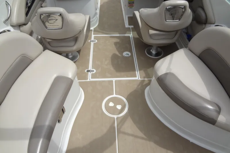 Slide: The Image of 2013 Crownline Eclipse E4 boat interior with beige seating and sleek design. - 56