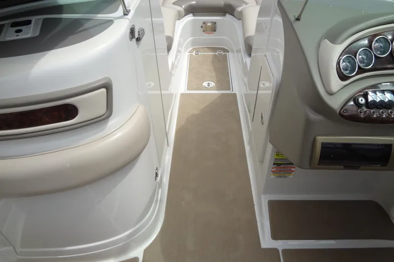 Slide: The Image of 2013 Crownline Eclipse E4 boat interior with dashboard and seating area. - 57