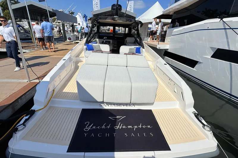 Slide: The Image of Luxury Santasevera 42 yacht at dock, showcasing elegant design and spacious deck, 2026 model. - 4