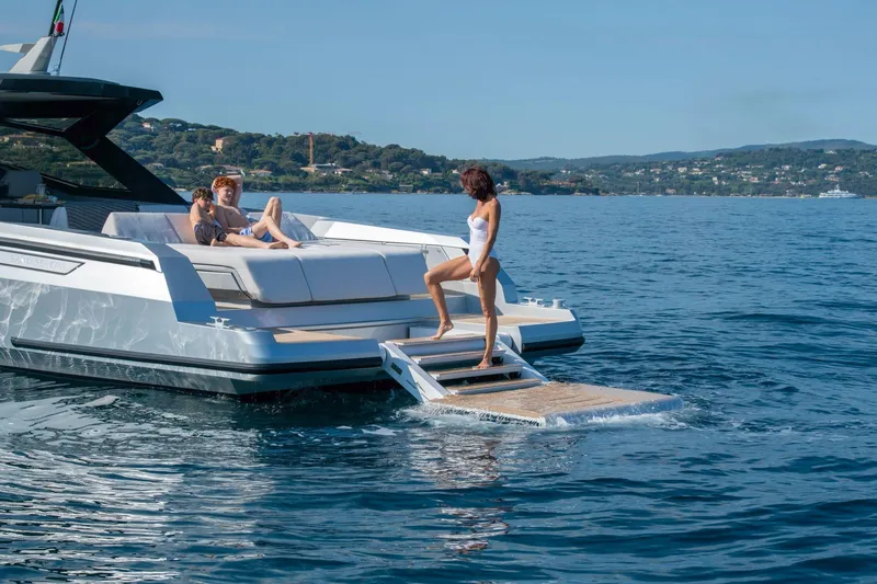 Slide: The Image of Luxury Santasevera 42 yacht, 2026 model, with people relaxing on deck in scenic waters. - 5