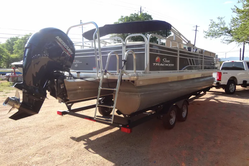 Slide: The Image of 2022 TRACKER MARINE Party Barge 24 DLX pontoon boat with Mercury engine on trailer. - 20
