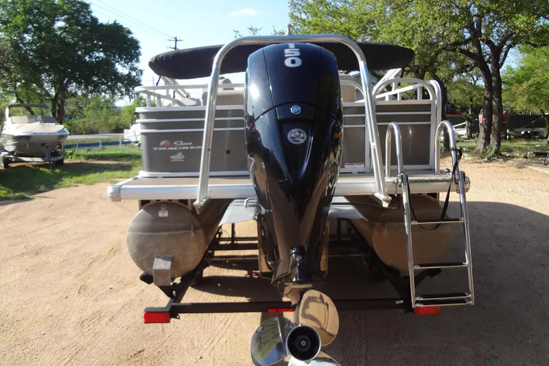 Slide: The Image of 2022 TRACKER MARINE Party Barge 24 DLX with powerful outboard motor. - 21