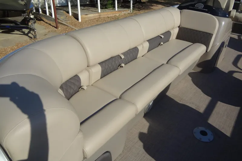 Slide: The Image of 2022 TRACKER MARINE Party Barge 24 DLX with beige seating and spacious layout. - 24
