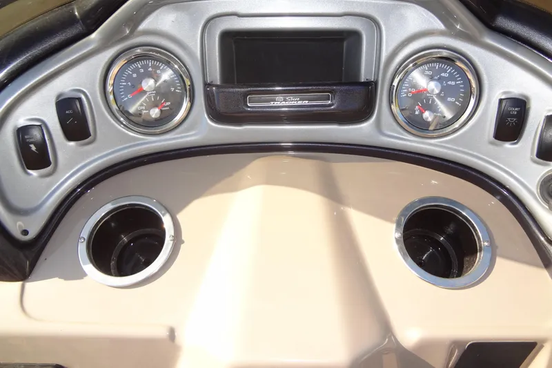 Slide: The Image of Dashboard of 2022 TRACKER MARINE Party Barge 24 DLX with gauges and cup holders. - 32