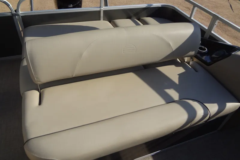Slide: The Image of 2022 TRACKER MARINE Party Barge 24 DLX, beige seating area with cup holder. - 36
