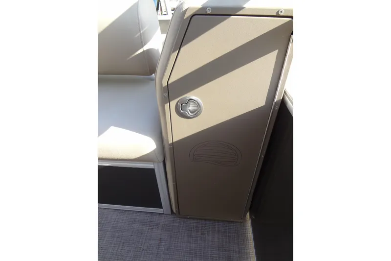 Slide: The Image of 2022 TRACKER MARINE Party Barge 24 DLX interior detail with seating and storage compartment. - 39