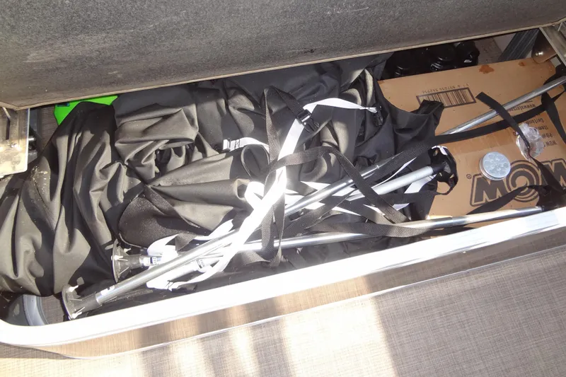 Slide: The Image of Storage compartment of 2022 TRACKER MARINE Party Barge 24 DLX with equipment and accessories. - 40