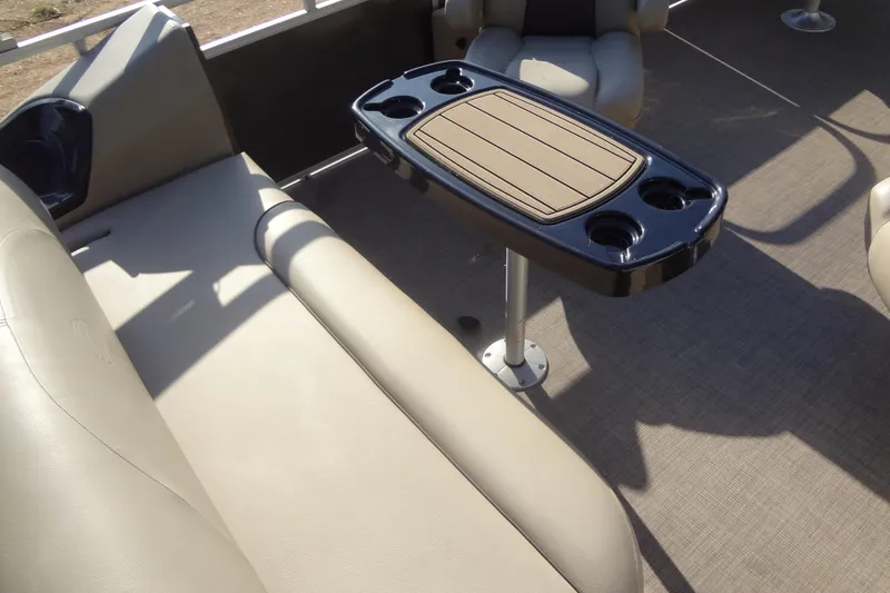 Slide: The Image of 2022 TRACKER MARINE Party Barge 24 DLX interior with seating and table. - 44