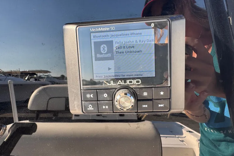 Slide: The Image of JL Audio MediaMaster 50 on 2022 Tidewater 2410 Bay Max boat, displaying Bluetooth connection. - 10