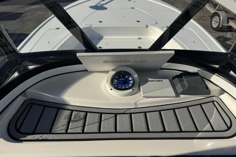 Slide: The Image of 2022 Tidewater 2410 Bay Max boat dashboard with Simrad navigation system. - 15