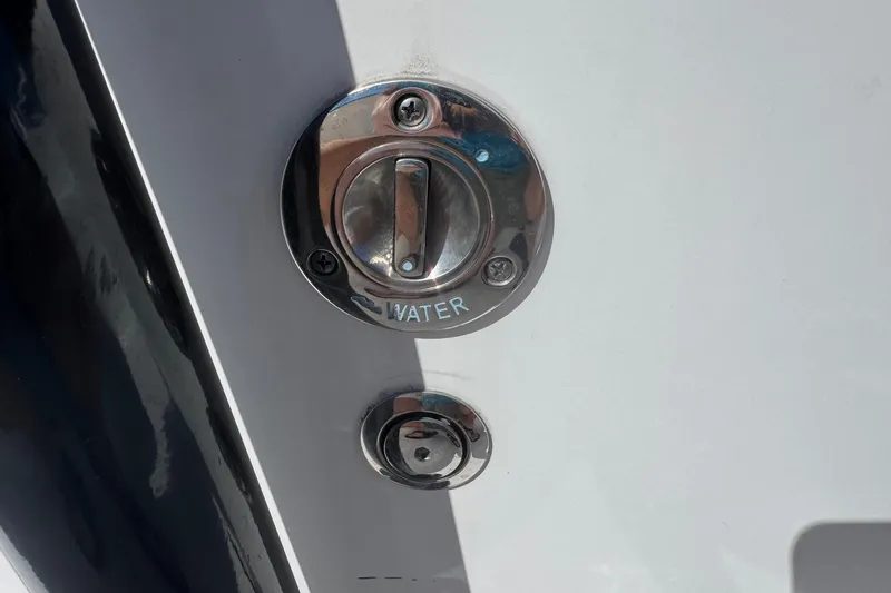 Slide: The Image of Close-up of water access panel on 2022 Tidewater 2410 Bay Max boat. - 19
