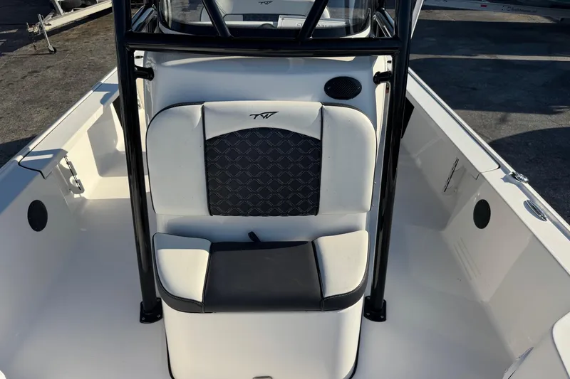 Slide: The Image of 2022 Tidewater 2410 Bay Max boat interior with cushioned seating and sleek design. - 20