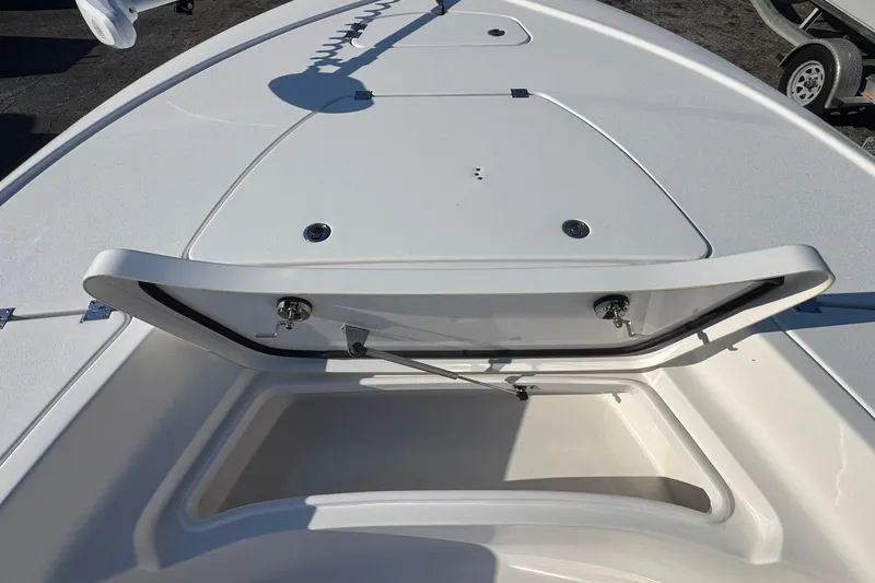 Slide: The Image of 2022 Tidewater 2410 Bay Max boat with open storage compartment on deck. - 24