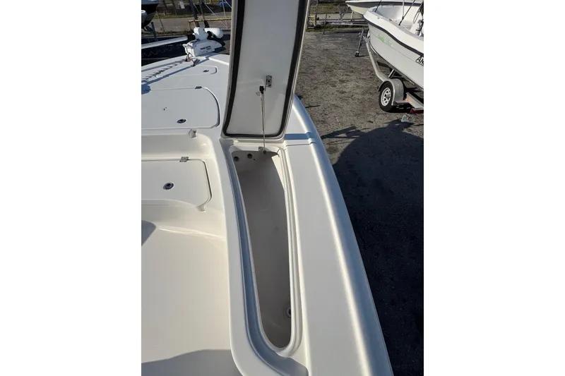 Slide: The Image of 2022 Tidewater 2410 Bay Max boat with open storage compartment on deck. - 25