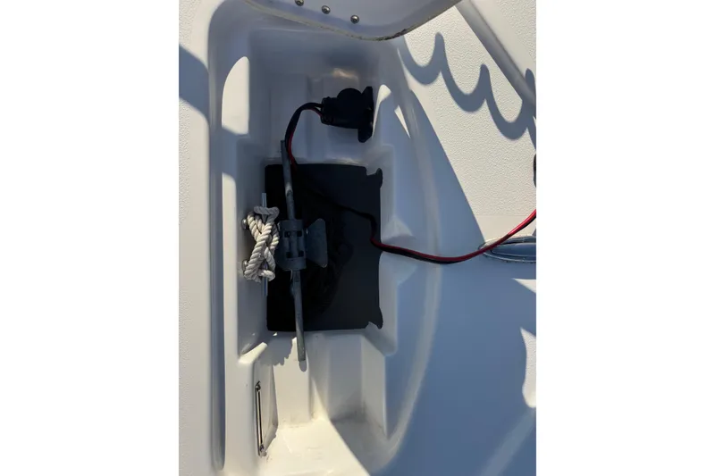 Slide: The Image of 2022 Tidewater 2410 Bay Max boat interior compartment with rope and wiring. - 27