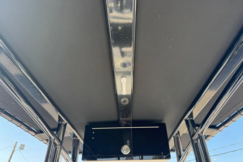 Slide: The Image of Tidewater 2410 Bay Max 2022 boat's T-top structure, viewed from below. - 48