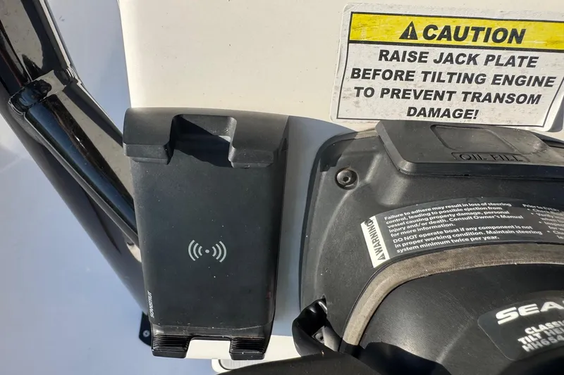Slide: The Image of Caution sign and engine components on 2022 Tidewater 2410 Bay Max boat. - 49