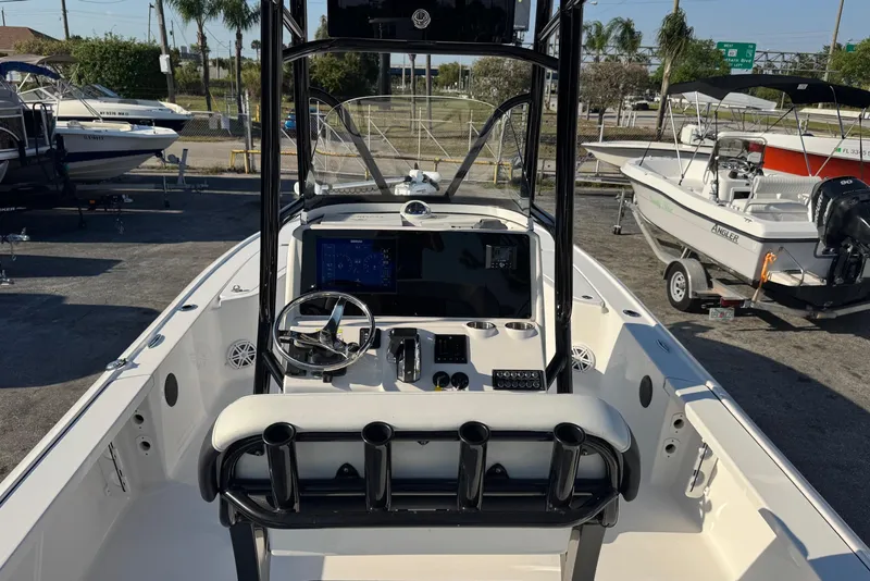 Slide: The Image of 2022 Tidewater 2410 Bay Max boat interior with steering console and seating. - 5