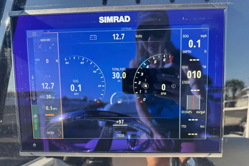 Slide: The Image of Simrad display on 2022 Tidewater 2410 Bay Max showing speed, fuel, and RPM data. - 9