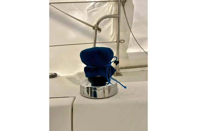 Slide: The Image of Blue-covered winch on 1998 Catalina 36 MkII sailboat deck. - 11