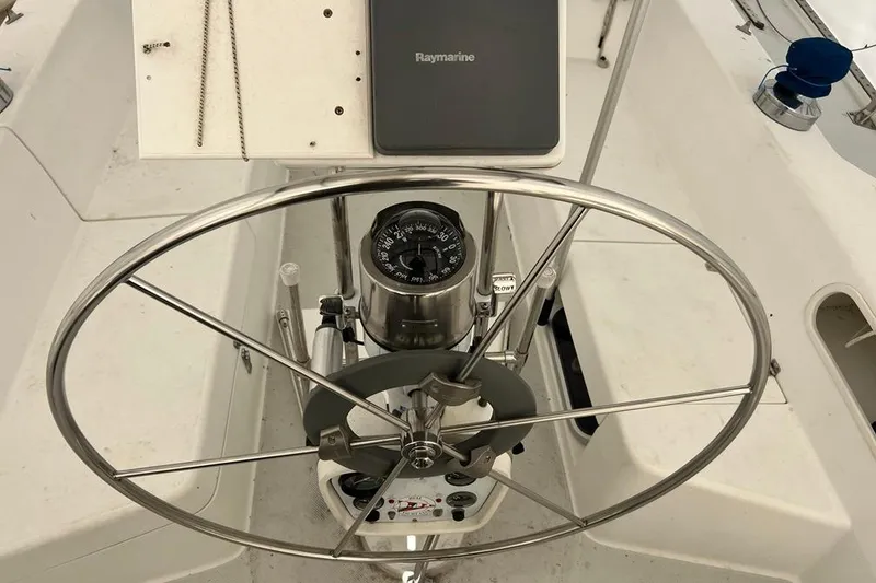 Slide: The Image of Steering wheel and compass on a 1998 Catalina 36 MkII sailboat. - 13