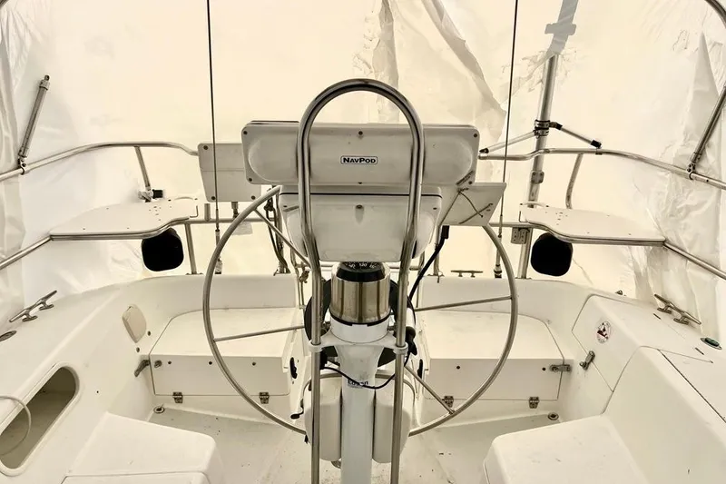 Slide: The Image of Cockpit of 1998 Catalina 36 MkII sailboat with steering wheel and navigation equipment. - 14