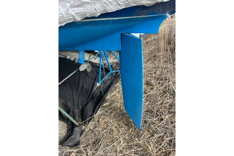 Slide: The Image of 1998 Catalina 36 MkII sailboat keel and rudder on dry land. - 19