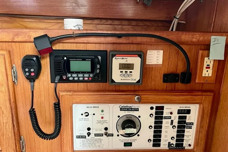 Slide: The Image of Control panel of a 1998 Catalina 36 MkII yacht with communication and monitoring equipment. - 23