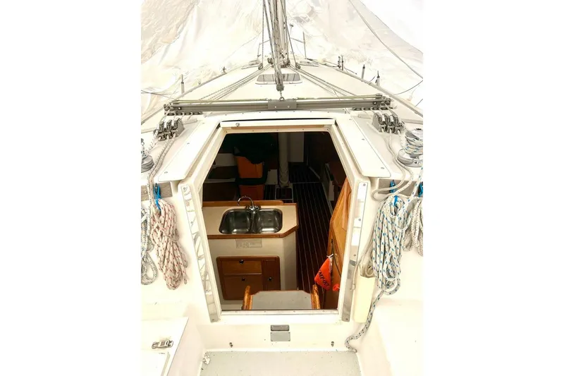 Slide: The Image of Interior view of 1998 Catalina 36 MkII sailboat, showing cabin entrance and kitchen sink. - 26