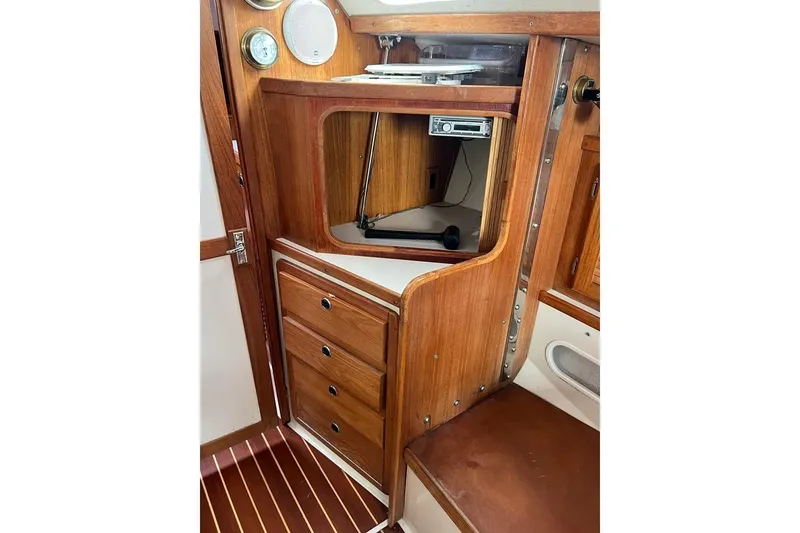 Slide: The Image of Interior of 1998 Catalina 36 MkII sailboat with wooden cabinetry and navigation instruments. - 28