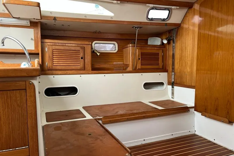 Slide: The Image of Interior of a 1998 Catalina 36 MkII sailboat with wooden cabinetry and seating. - 31